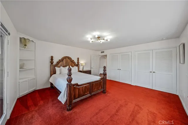 a bed room with a bed and a lamp