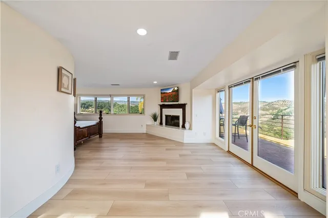 a view of a livingroom with kitchen and furniture