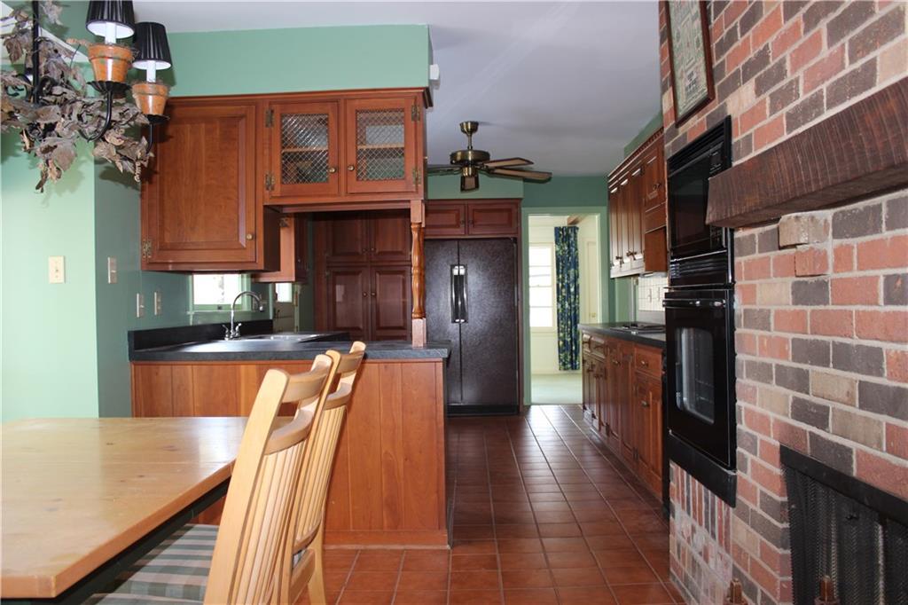 134 Glade Run Road Mars, PA 16046 - Photo 12 of 25 View of kitchen from eat in area by fireplace