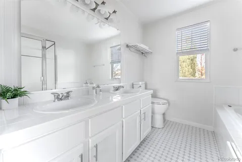 a bathroom with a tub and a shower