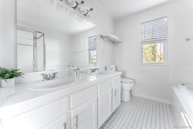 a bathroom with a tub and a shower