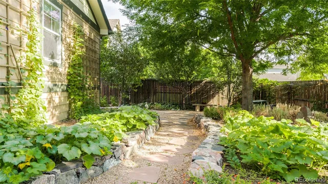 a view of front door and small yard