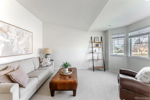 a living room with furniture and window