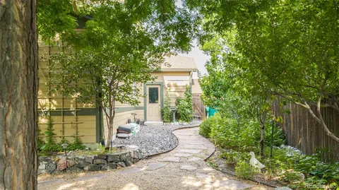 a outdoor living space with patio furniture and garden view