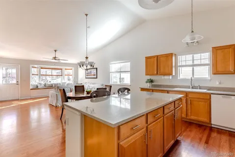 a kitchen with stainless steel appliances a sink a stove and a microwave