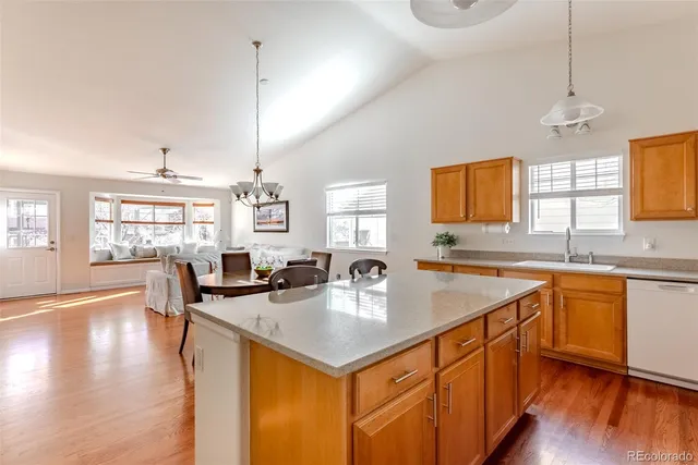 a kitchen with stainless steel appliances a sink a stove and a microwave