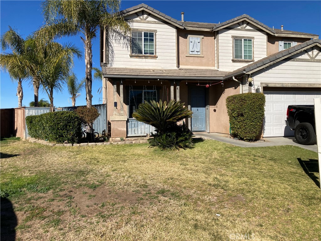 1210 Indigo Way Perris, CA 92571 - Photo 1 of 1 a front view of a house with a yard