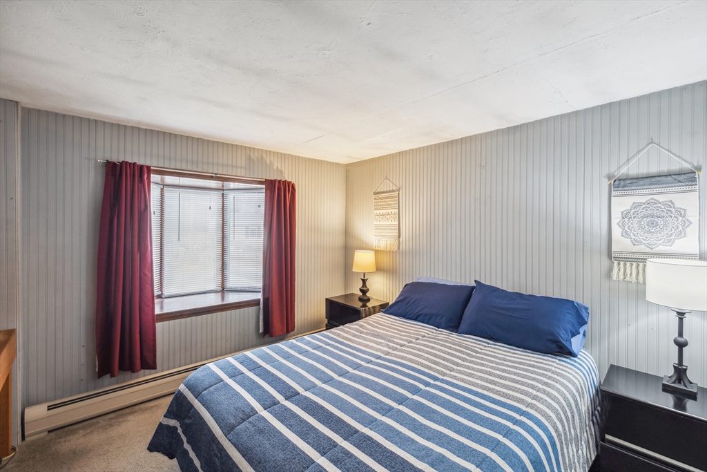 20 Hemlock Road Holbrook, MA 02343 - Photo 11 of 32 a bedroom with a bed and a lamp