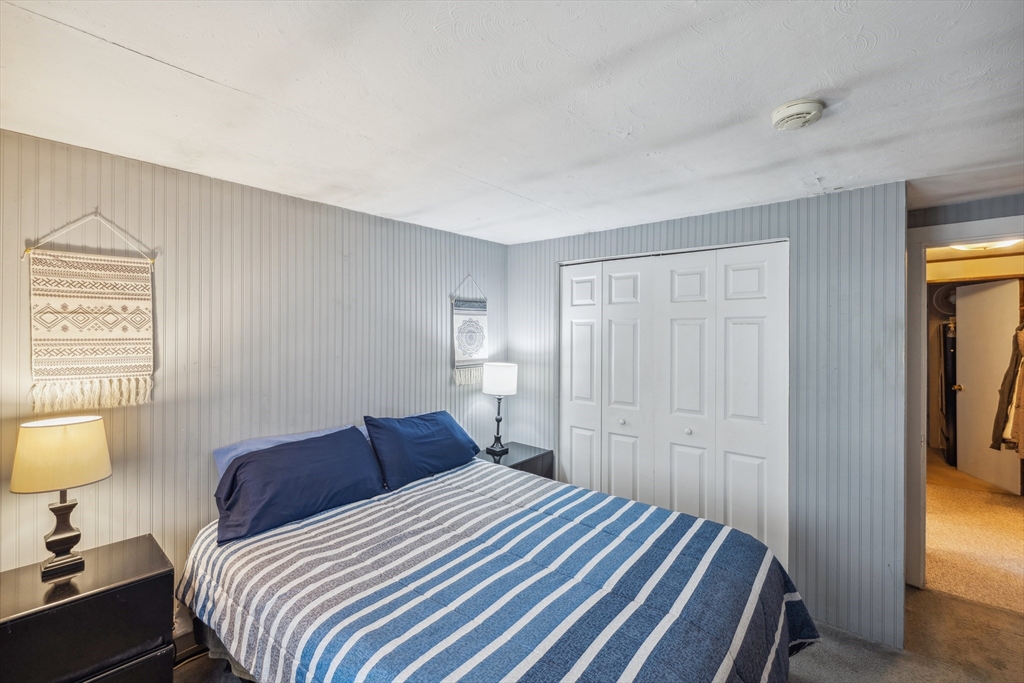 20 Hemlock Road Holbrook, MA 02343 - Photo 12 of 32 a bedroom with a bed and a lamp
