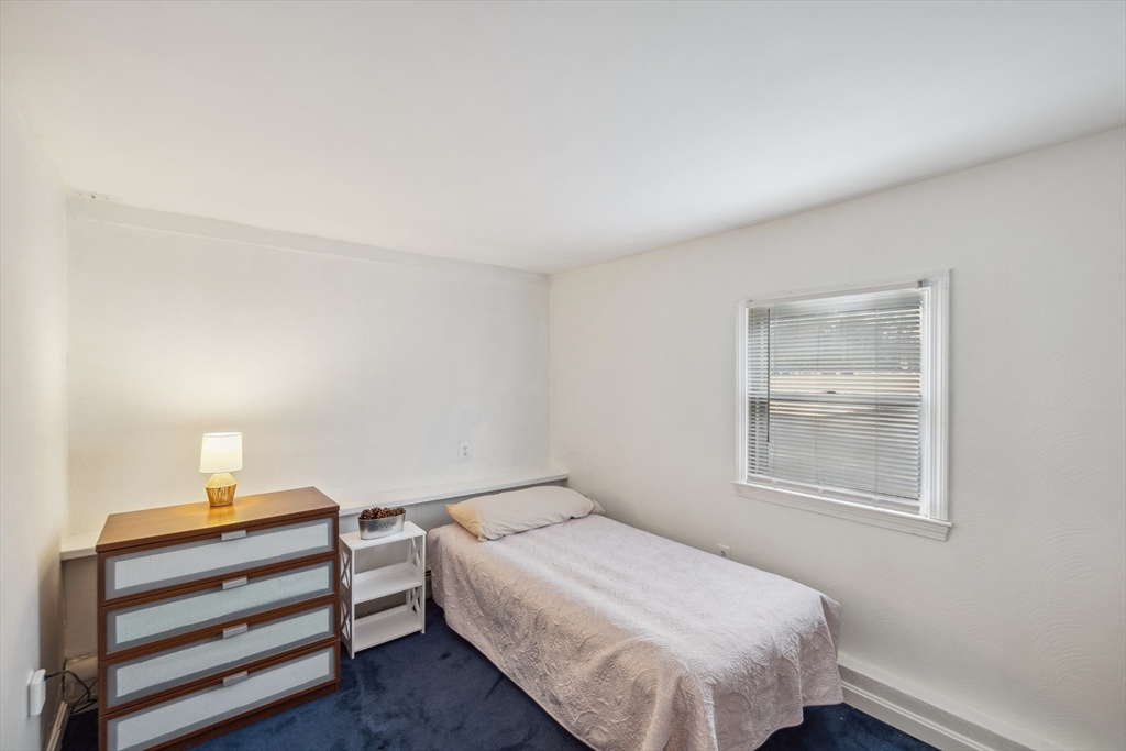 20 Hemlock Road Holbrook, MA 02343 - Photo 13 of 32 a bedroom with a bed and a window
