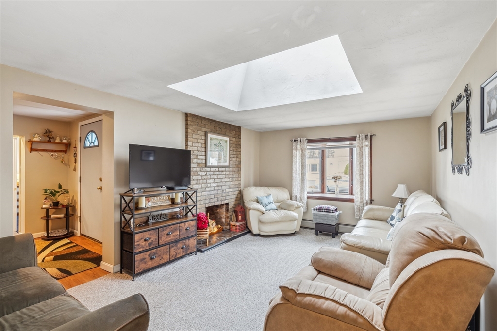 20 Hemlock Road Holbrook, MA 02343 - Photo 6 of 32 a living room with furniture and a flat screen tv