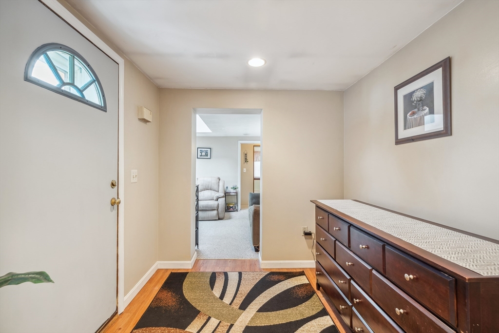 20 Hemlock Road Holbrook, MA 02343 - Photo 7 of 32 a bedroom with a bed and a chandelier