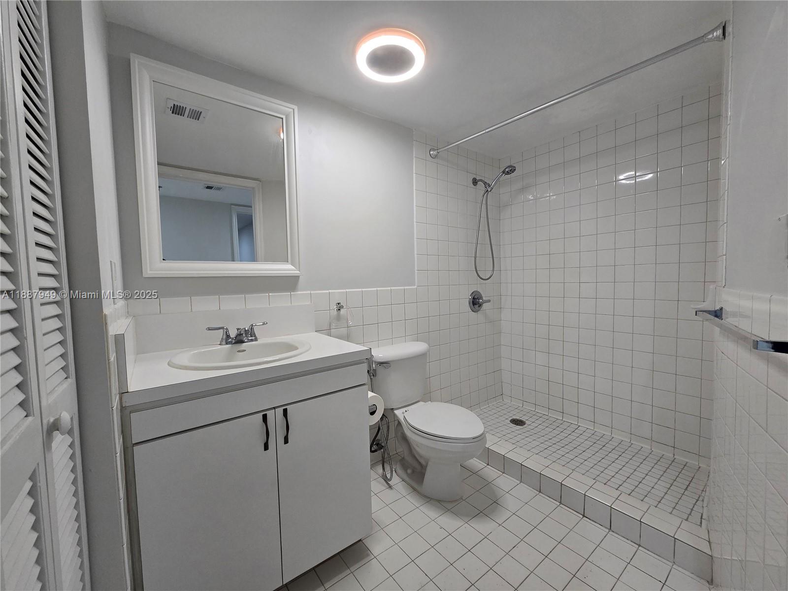 55 East 4th Street, Unit 302 Hialeah, FL 33010 - Photo 13 of 15 a bathroom with a sink toilet and shower