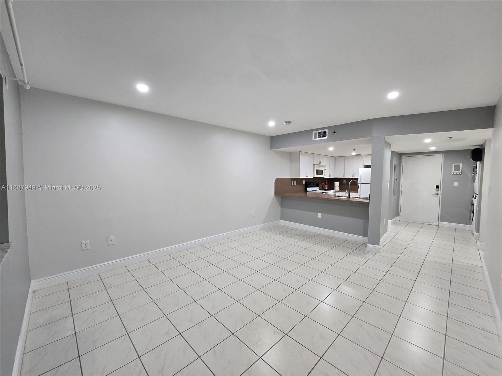 55 East 4th Street, Unit 302 Hialeah, FL 33010 - Photo 9 of 15 a large white room with natural light