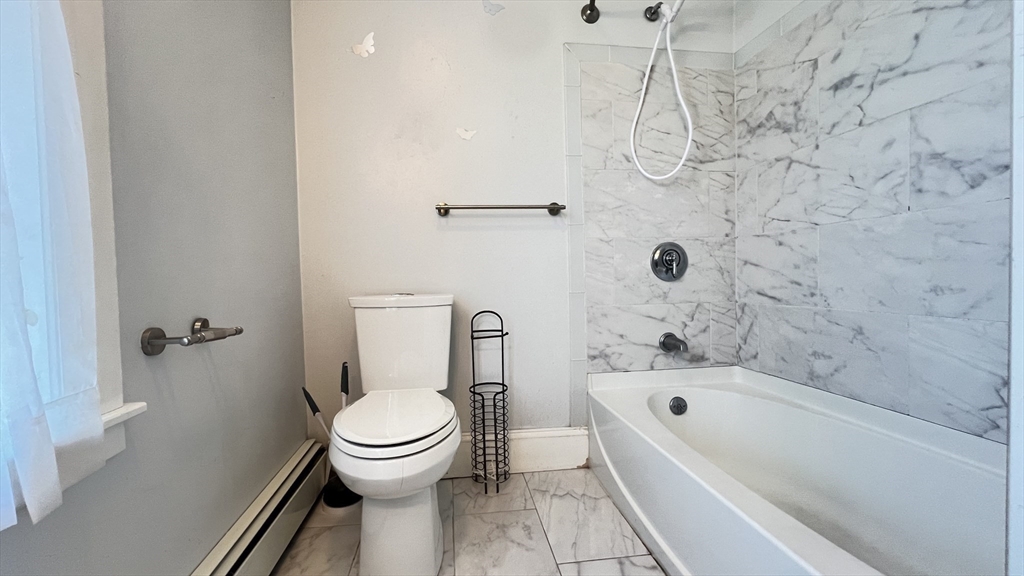 3 Mill St Court, Unit 2 Danvers, MA 01923 - Photo 13 of 23 a bathroom with a toilet and a bathtub