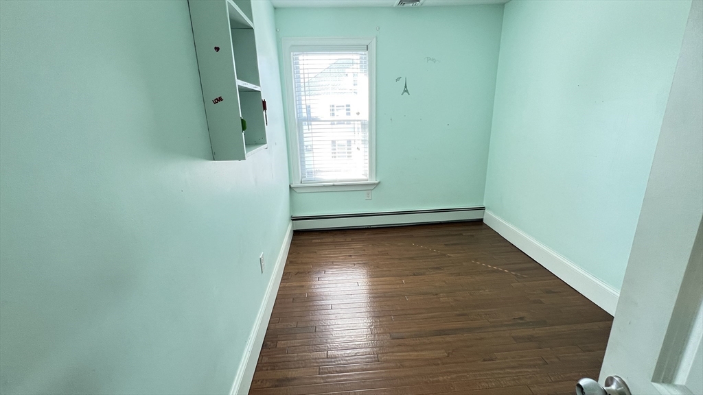3 Mill St Court, Unit 2 Danvers, MA 01923 - Photo 8 of 23 a view of a room with wooden floor and a window