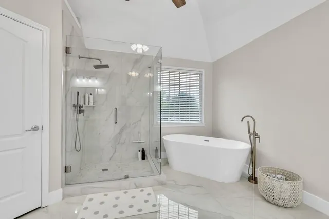a bathroom with double vanity sinks and a mirror