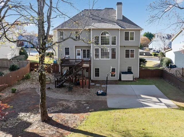 a view of a swimming pool with outdoor seating
