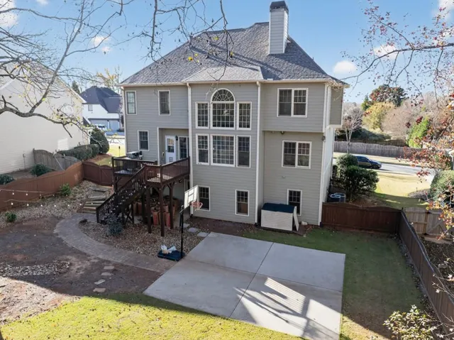 an aerial view of a house with swimming pool