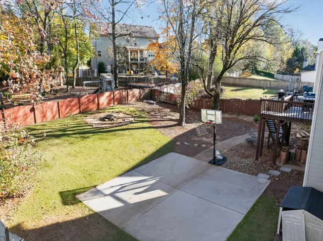 a picture of a bathroom with a white wall and a refrigerator