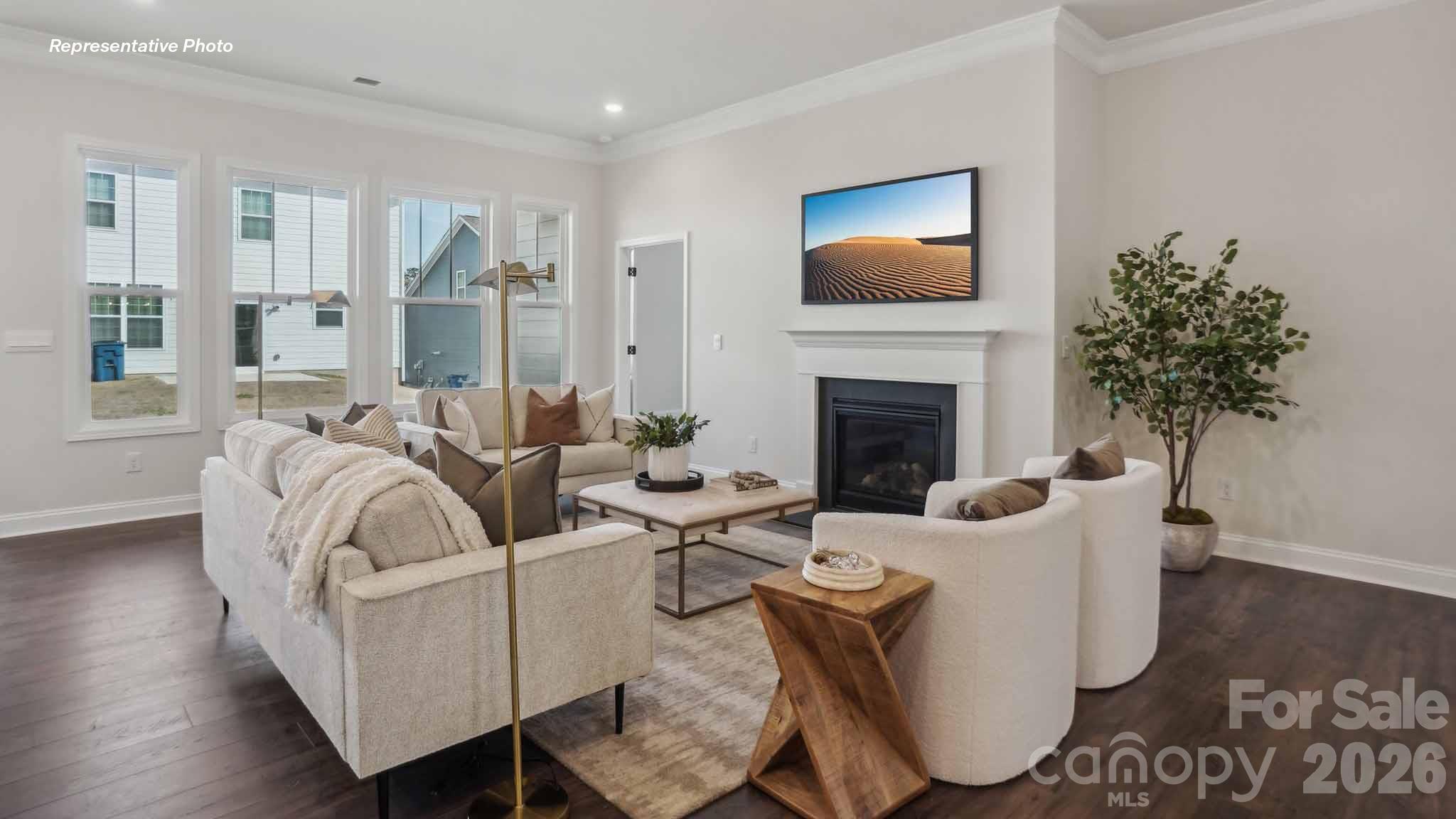 7625 Bainbridge Road Sherrills Ford, NC 28673 - Photo 11 of 24 a living room with furniture fireplace and a flat screen tv