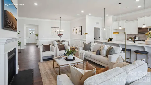 a living room with fireplace furniture and a flat screen tv