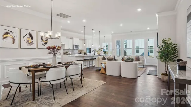 a view of a dining room kitchen with furniture and wooden floor