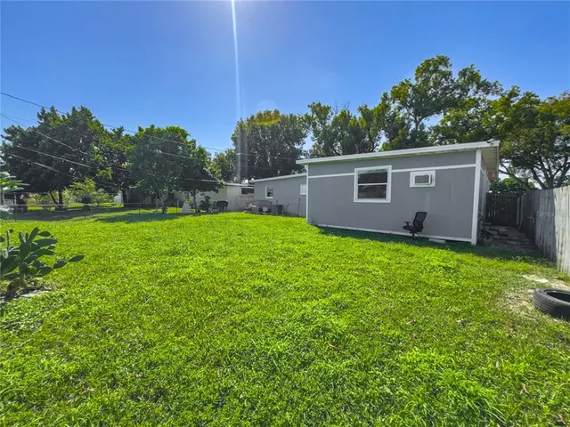 a backyard of a house with lots of green space