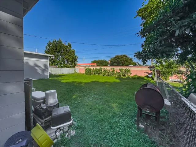 a view of a chairs in a backyard
