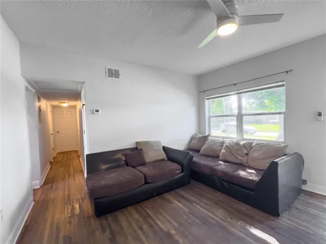 a living room with furniture and a window