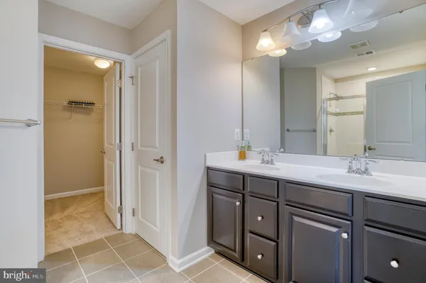 a bathroom with a glass shower door