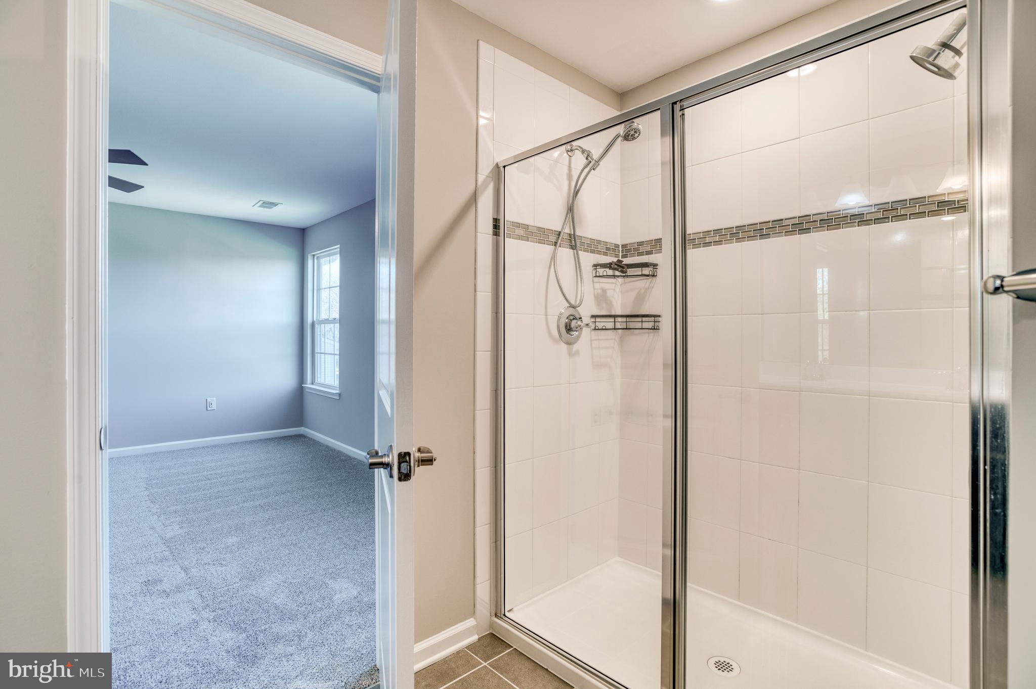 14510 Kingsmill Way Culpeper, VA 22701 - Photo 25 of 64 a bathroom with a glass shower door