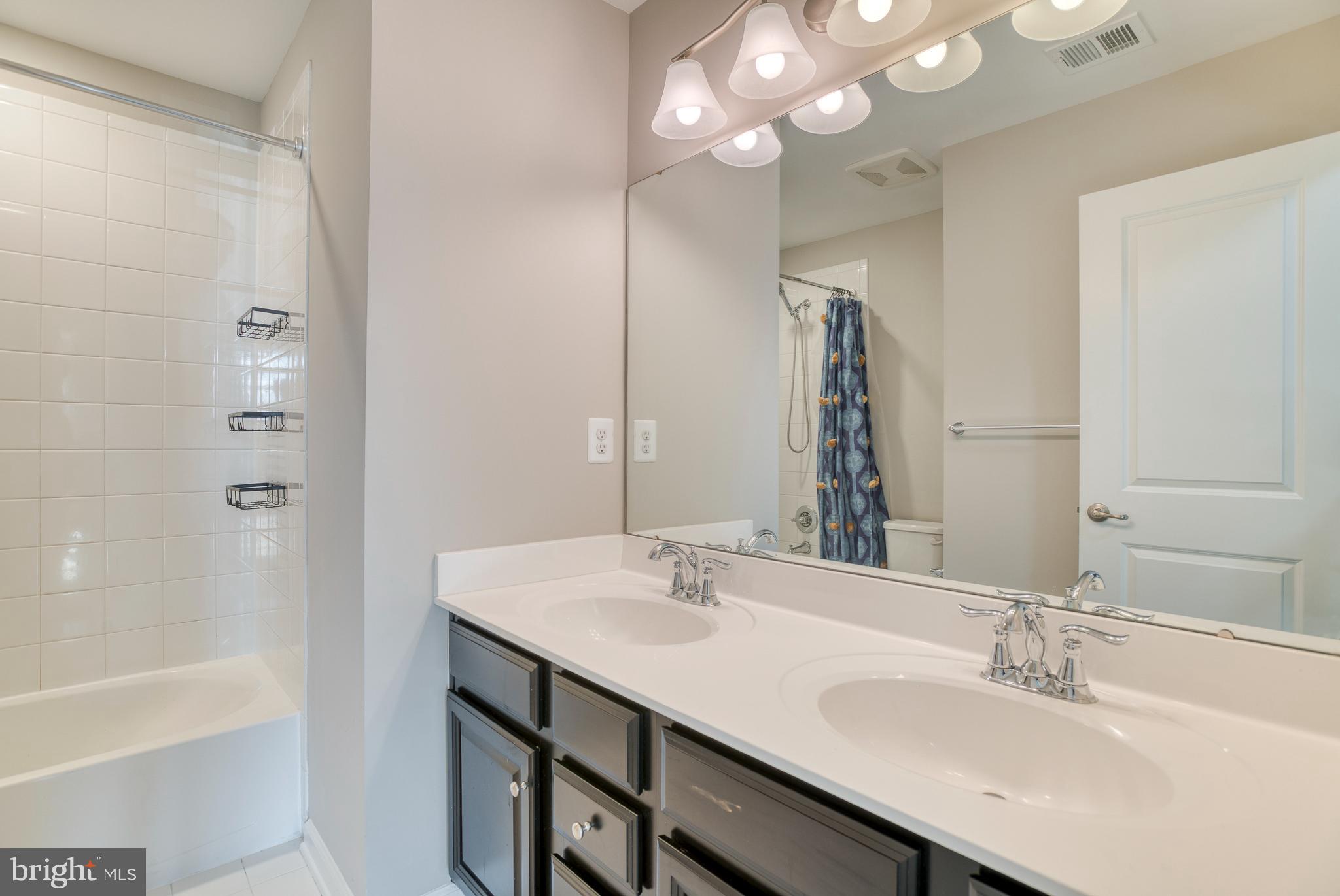 14510 Kingsmill Way Culpeper, VA 22701 - Photo 34 of 64 a bathroom with a sink double vanity and a mirror