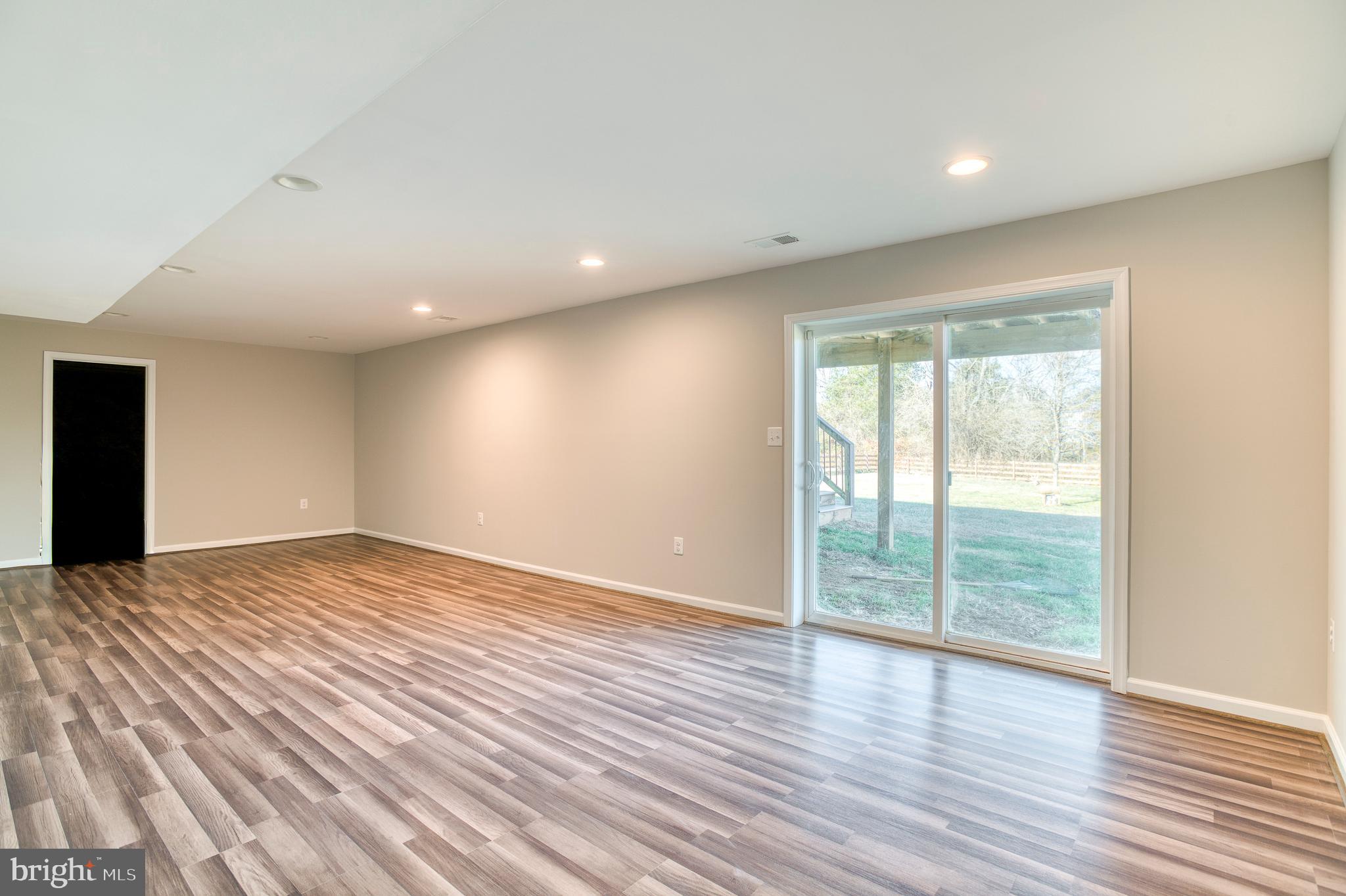 14510 Kingsmill Way Culpeper, VA 22701 - Photo 37 of 64 a view of empty room with wooden floor and fan