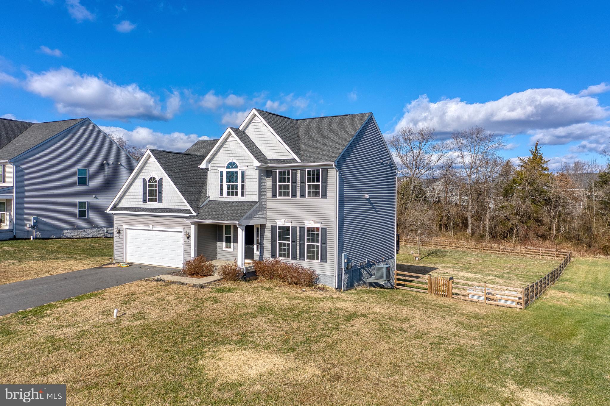 14510 Kingsmill Way Culpeper, VA 22701 - Photo 50 of 64 a view of a big house with a big yard and large trees
