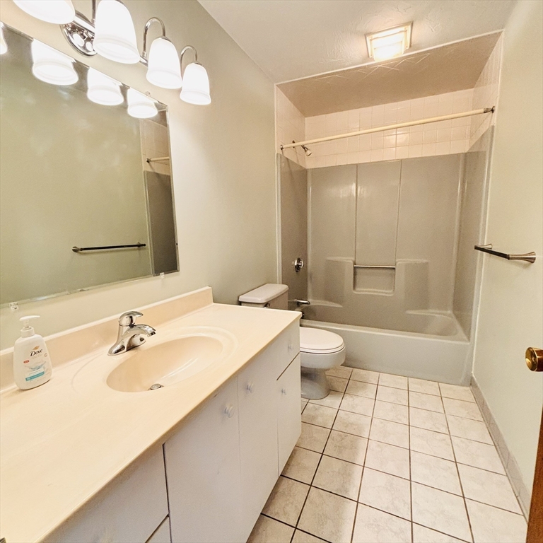 364 Neponset Street, Unit K Canton, MA 02021 - Photo 8 of 15 a bathroom with a sink a toilet and shower