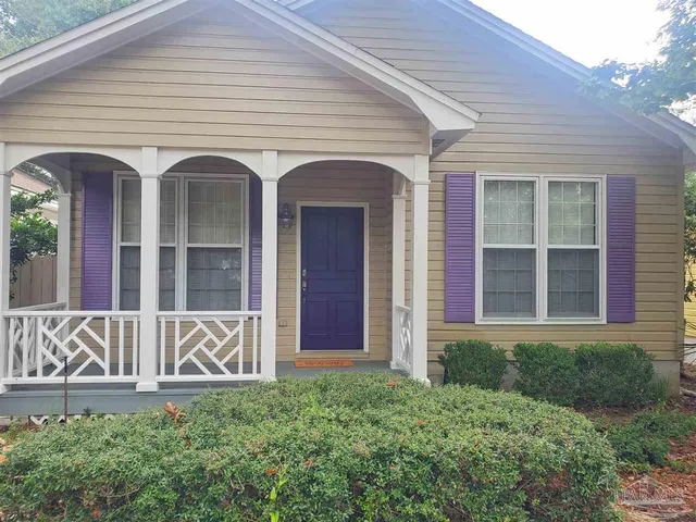 front view of a house with a yard