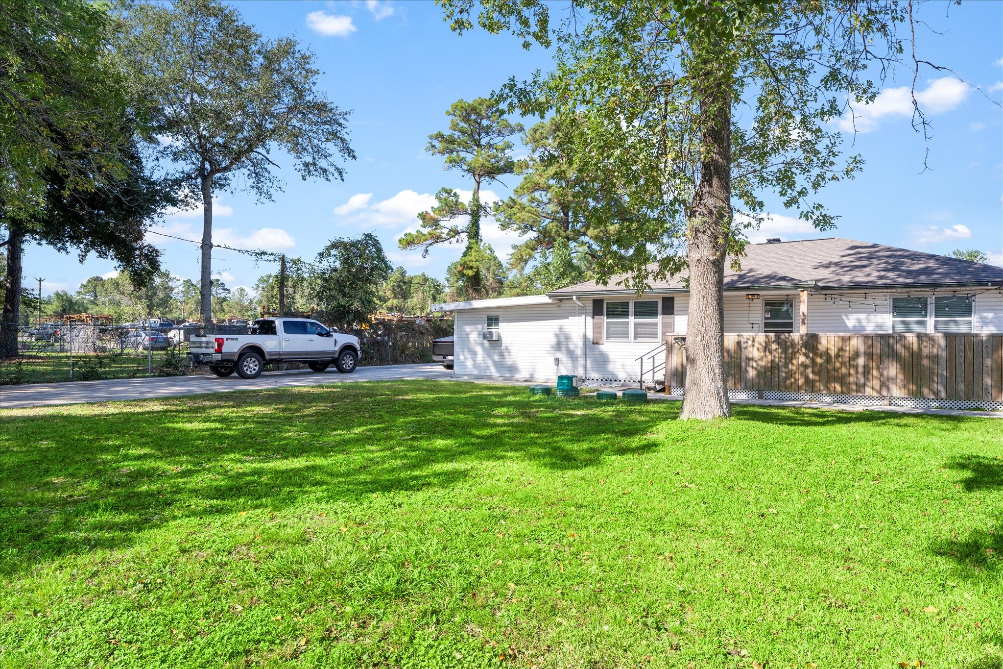 9902 Franklin Road Houston, TX 77070 - Photo 28 of 43 a view of a house with backyard and a tree