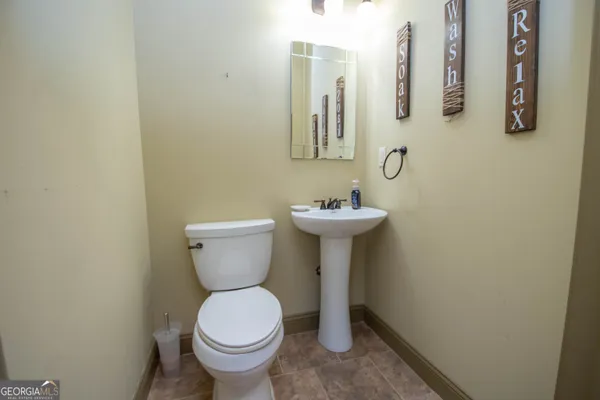 a view of a balcony with chair and chandelier