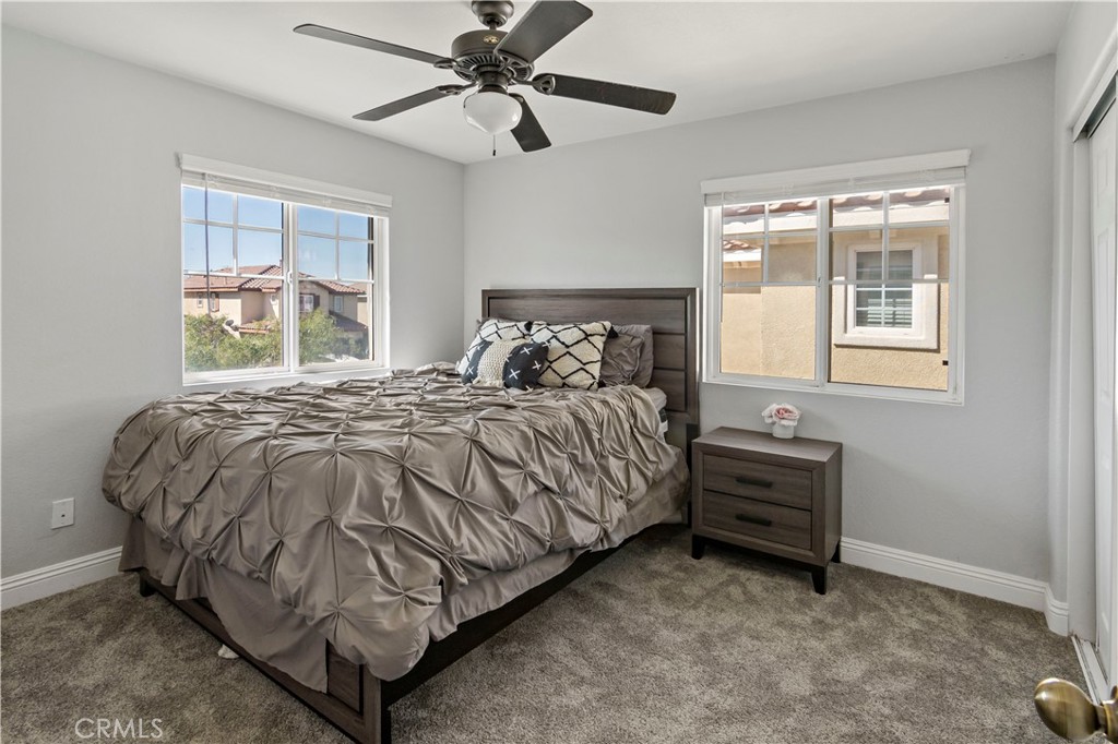 1664 Rigel Street Beaumont, CA 92223 - Photo 24 of 32 a bed sitting in a bedroom next to a window