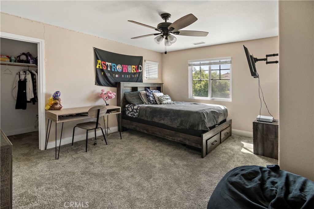 1664 Rigel Street Beaumont, CA 92223 - Photo 25 of 32 a living room with furniture and a window