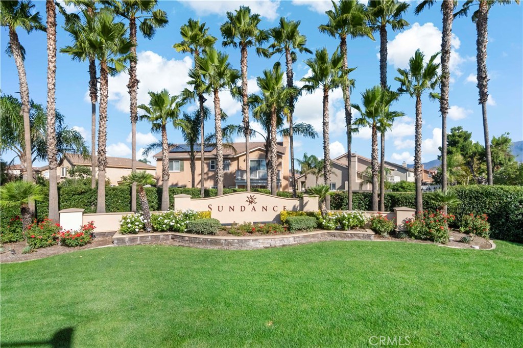 1664 Rigel Street Beaumont, CA 92223 - Photo 28 of 32 a view of a garden with a building and palm trees