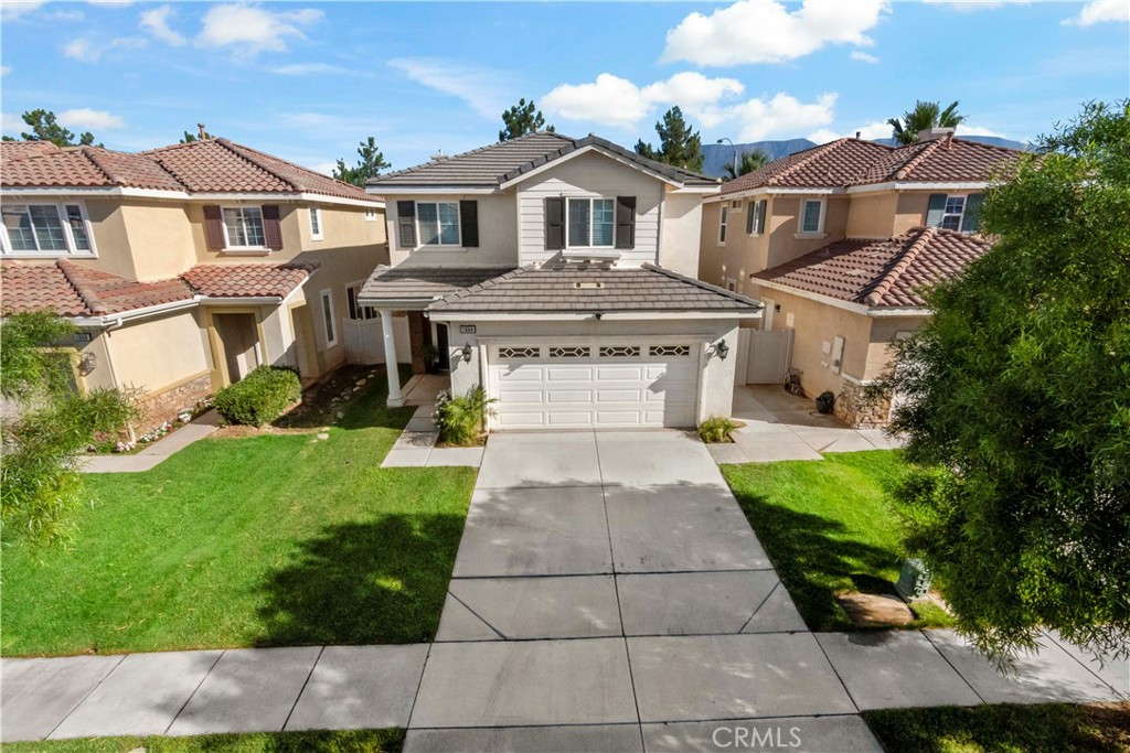 1664 Rigel Street Beaumont, CA 92223 - Photo 31 of 32 a front view of a house with a yard