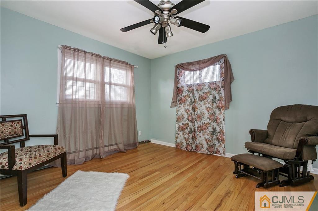 5 Baldwin Road Edison, NJ 08817 - Photo 12 of 25 a bedroom with a bed and a chair