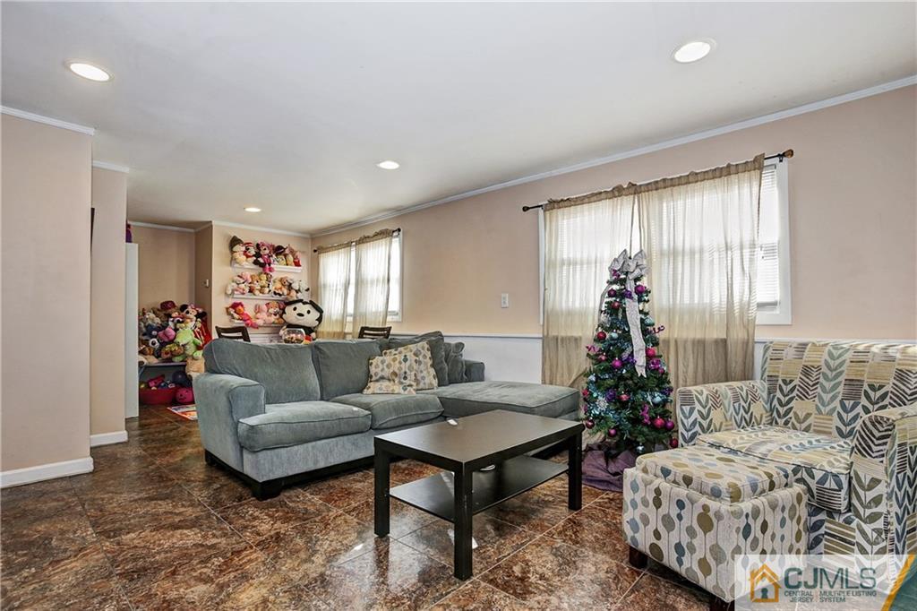 5 Baldwin Road Edison, NJ 08817 - Photo 13 of 25 a living room with furniture and a large window