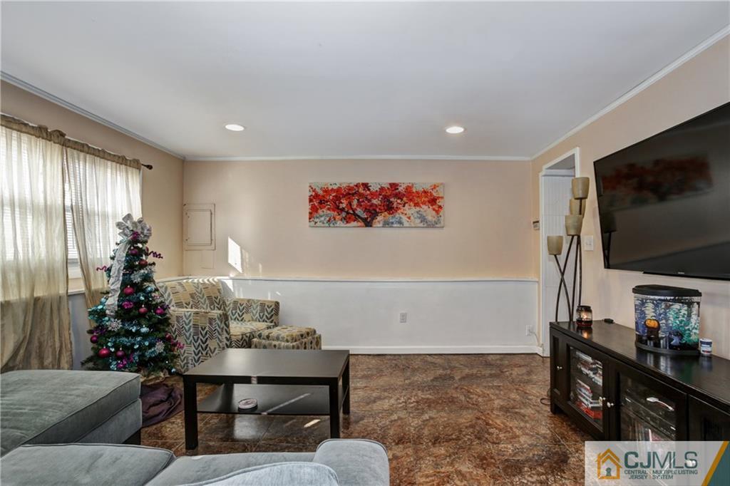 5 Baldwin Road Edison, NJ 08817 - Photo 14 of 25 a living room with furniture and a flat screen tv