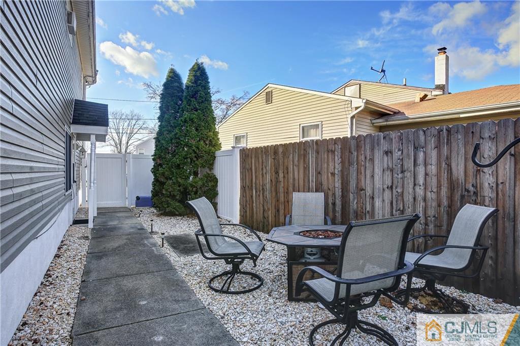 5 Baldwin Road Edison, NJ 08817 - Photo 21 of 25 a view of a patio with table and chairs and potted plants