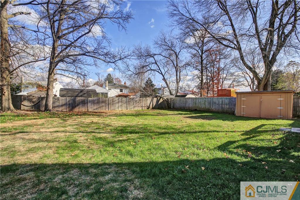 5 Baldwin Road Edison, NJ 08817 - Photo 22 of 25 a backyard of a house with lots of green space