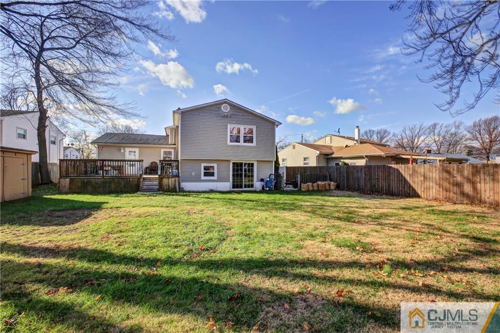 5 Baldwin Road Edison, NJ 08817 - Photo 23 of 25 a large house with a big yard and large trees