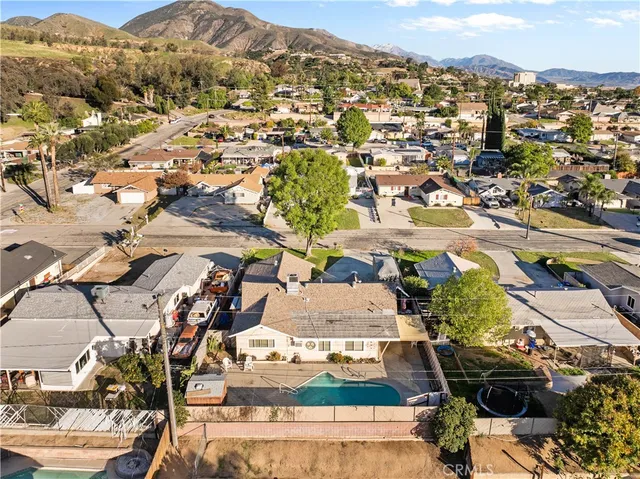 an aerial view of residential houses with outdoor space